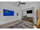 Bedroom with a TV, a gray rug, and white walls at 12720 Davis Wright Ct, Henderson, NV 89044