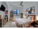 Staged bedroom with modern decor, a comfy bed, and natural light at 12720 Davis Wright Ct, Henderson, NV 89044