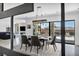 Dining room featuring modern table with chairs, stylish lighting, and view of the outdoor space at 12720 Davis Wright Ct, Henderson, NV 89044