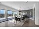 Dining room with modern table, chairs, and large glass doors to the patio providing ample natural light at 12720 Davis Wright Ct, Henderson, NV 89044