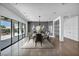 Dining area with a stylish table, chairs, and large glass doors opening to the outdoor patio space at 12720 Davis Wright Ct, Henderson, NV 89044