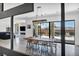 A dining room with seating, a modern light fixture, and access to a patio at 12720 Davis Wright Ct, Henderson, NV 89044