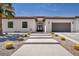 Charming single-story home featuring a tile roof, desert landscaping, and a spacious driveway at 12720 Davis Wright Ct, Henderson, NV 89044
