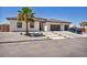 Charming single-story home featuring a tile roof, desert landscaping, and a spacious driveway at 12720 Davis Wright Ct, Henderson, NV 89044
