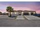 Charming single-story home featuring a tile roof, desert landscaping, and a spacious driveway at 12720 Davis Wright Ct, Henderson, NV 89044