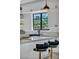 Bright kitchen featuring sleek countertops, a modern faucet, and bar stool seating at 12720 Davis Wright Ct, Henderson, NV 89044