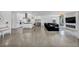 Spacious living area featuring a modern fireplace, large sofa and bright open floor plan at 12720 Davis Wright Ct, Henderson, NV 89044