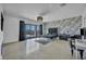 Spacious main bedroom with a balcony, statement wall, and modern furnishings at 12720 Davis Wright Ct, Henderson, NV 89044