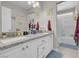 Bathroom with granite countertop vanity, dual sinks and shower/tub combo at 1581 Cavalry St, Pahrump, NV 89048