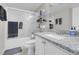 Modern bathroom featuring sleek fixtures, a granite countertop, and a shower with glass doors at 1581 Cavalry St, Pahrump, NV 89048