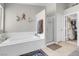 A bright bathroom showing a separate shower and tub and a walk-in closet at 1581 Cavalry St, Pahrump, NV 89048