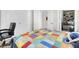 A comfy bedroom with a colorful bedspread, offering a welcoming space to relax at 1581 Cavalry St, Pahrump, NV 89048