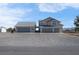 Exterior angle showcasing a two story home and three car garage with driveway at 1581 Cavalry St, Pahrump, NV 89048