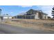 Wide exterior angle of a two story stucco home with a three car garage at 1581 Cavalry St, Pahrump, NV 89048