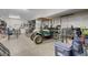 Spacious garage area with a golf cart, storage containers, and additional space for parking at 1581 Cavalry St, Pahrump, NV 89048