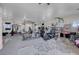 Spacious garage transformed into a home gym with various exercise equipment and weightlifting machines at 1581 Cavalry St, Pahrump, NV 89048