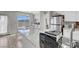 Eat-in kitchen area with stainless steel refrigerator, granite countertops, and a picturesque view at 1581 Cavalry St, Pahrump, NV 89048