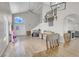 Spacious living room with high ceilings, hardwood floor, and staircase with natural light at 1581 Cavalry St, Pahrump, NV 89048