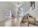 Living room showcasing vaulted ceiling, wood flooring, front entrance and natural light at 1581 Cavalry St, Pahrump, NV 89048
