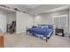 Comfortable main bedroom with cozy carpet and a decorative blue comforter at 1581 Cavalry St, Pahrump, NV 89048