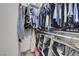 Walk-in closet is well-organized with hanging clothes, folded garments, and storage solutions at 1581 Cavalry St, Pahrump, NV 89048