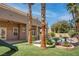 Spacious backyard with artificial grass, blooming flowers, and backyard pool at 1790 Castro Hill Ave, Henderson, NV 89012