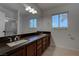 Bathroom with double sink vanity, granite countertops, and a large mirror at 1790 Castro Hill Ave, Henderson, NV 89012