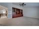 Large bonus room featuring carpeted flooring, ceiling fan, and custom cabinetry at 1790 Castro Hill Ave, Henderson, NV 89012