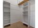 Walk-in closet with shelves and hanging rods at 1790 Castro Hill Ave, Henderson, NV 89012