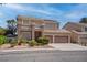 Two-story home features manicured landscaping and a convenient two-car garage at 1790 Castro Hill Ave, Henderson, NV 89012