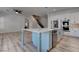 Open-concept kitchen boasts a large island, stainless appliances, and eat-in dining at 1790 Castro Hill Ave, Henderson, NV 89012