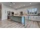 Bright kitchen features a large island, stainless appliances, and decorative tile backsplash at 1790 Castro Hill Ave, Henderson, NV 89012