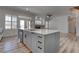 Open concept space featuring kitchen island with barstool seating at 1790 Castro Hill Ave, Henderson, NV 89012