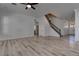 Open floor plan with wood floors, staircase, and ceiling fan at 1790 Castro Hill Ave, Henderson, NV 89012