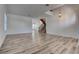 Bright living room featuring beautiful wood floors and staircase leading upstairs at 1790 Castro Hill Ave, Henderson, NV 89012