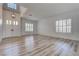 Bright and airy living room featuring new floors and large windows for ample natural light at 1790 Castro Hill Ave, Henderson, NV 89012