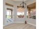 Bright bonus room with views of the patio and golf course through large windows at 2024 Bay Tree Dr, Las Vegas, NV 89134
