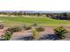Beautiful golf course view showcasing immaculate greens and desert landscaping with stone features at 2024 Bay Tree Dr, Las Vegas, NV 89134