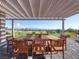 Outdoor patio with table, chairs, and scenic golf course views at 2024 Bay Tree Dr, Las Vegas, NV 89134