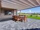 Covered patio with dining area and golf course views at 2024 Bay Tree Dr, Las Vegas, NV 89134