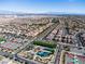 Aerial view shows the community park, tennis courts, and surrounding neighborhood at 2116 Via Firenze, Henderson, NV 89044