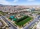 Aerial view of a neighborhood park with a playground and sports courts at 2116 Via Firenze, Henderson, NV 89044