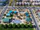 Aerial view of a neighborhood park featuring a playground and green spaces at 2116 Via Firenze, Henderson, NV 89044