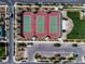Aerial view featuring community tennis courts with parking and landscaping for active recreation at 2116 Via Firenze, Henderson, NV 89044