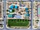 Aerial view showcases the community park with playground, green space, and picnic pavilions for residents at 2116 Via Firenze, Henderson, NV 89044