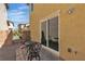 Private back patio has chairs, a table, and a brick floor for a relaxing outdoor space at 2116 Via Firenze, Henderson, NV 89044