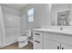 Bathroom featuring a shower-tub combo, toilet, vanity, and neutral color palette at 2116 Via Firenze, Henderson, NV 89044
