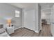 Cozy bedroom with a nightstand, lamp, and closet, offering a private and comfortable space at 2116 Via Firenze, Henderson, NV 89044