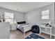 Cozy bedroom with natural light, laminate flooring, and simple furnishings at 2116 Via Firenze, Henderson, NV 89044