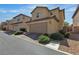 Exterior view of a two-story home with a two-car garage and landscaped front yard, offering curb appeal at 2116 Via Firenze, Henderson, NV 89044